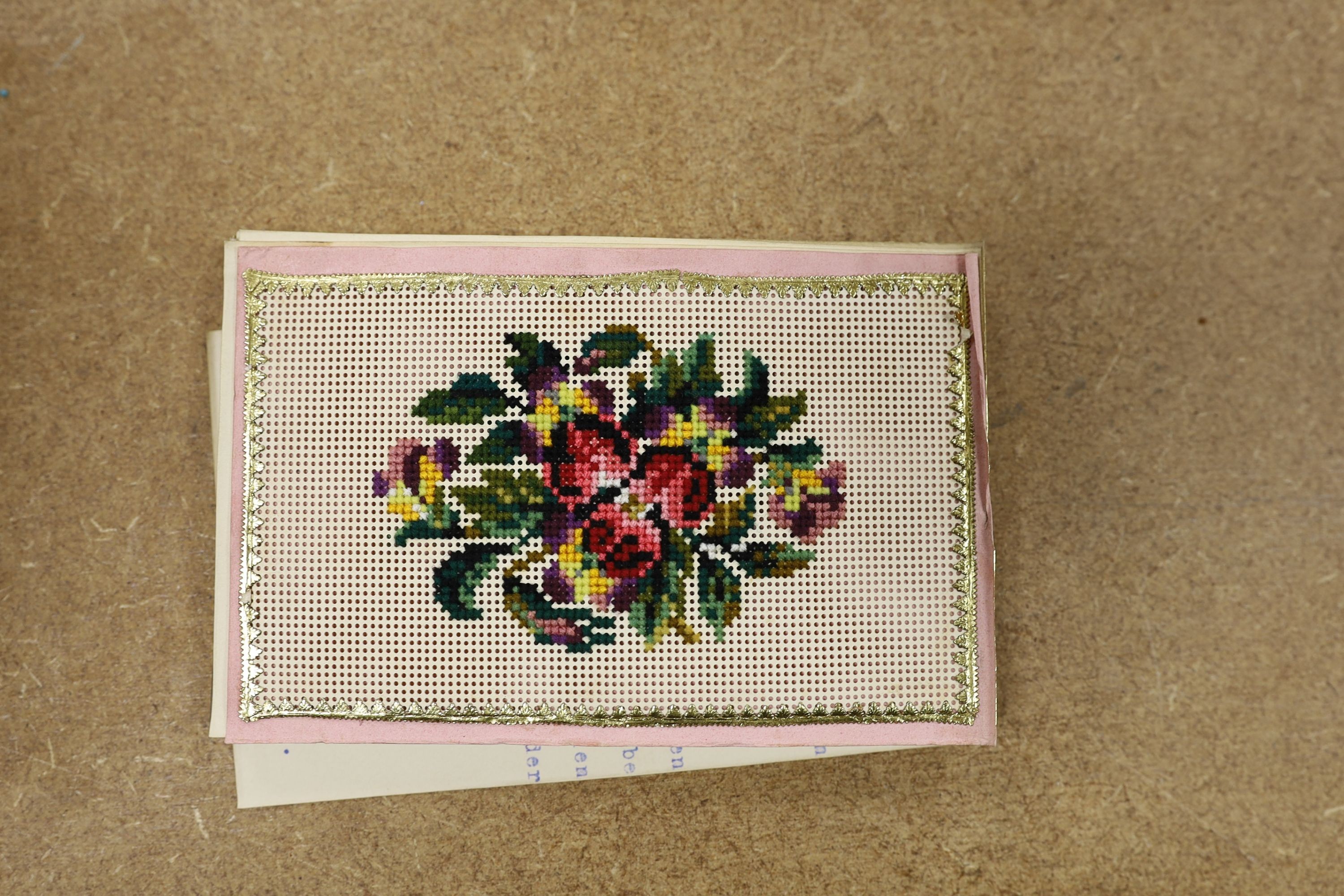 An Austrian beadwork cover souvenir album of watercolours and Berlin woolwork., 15 cms wide.